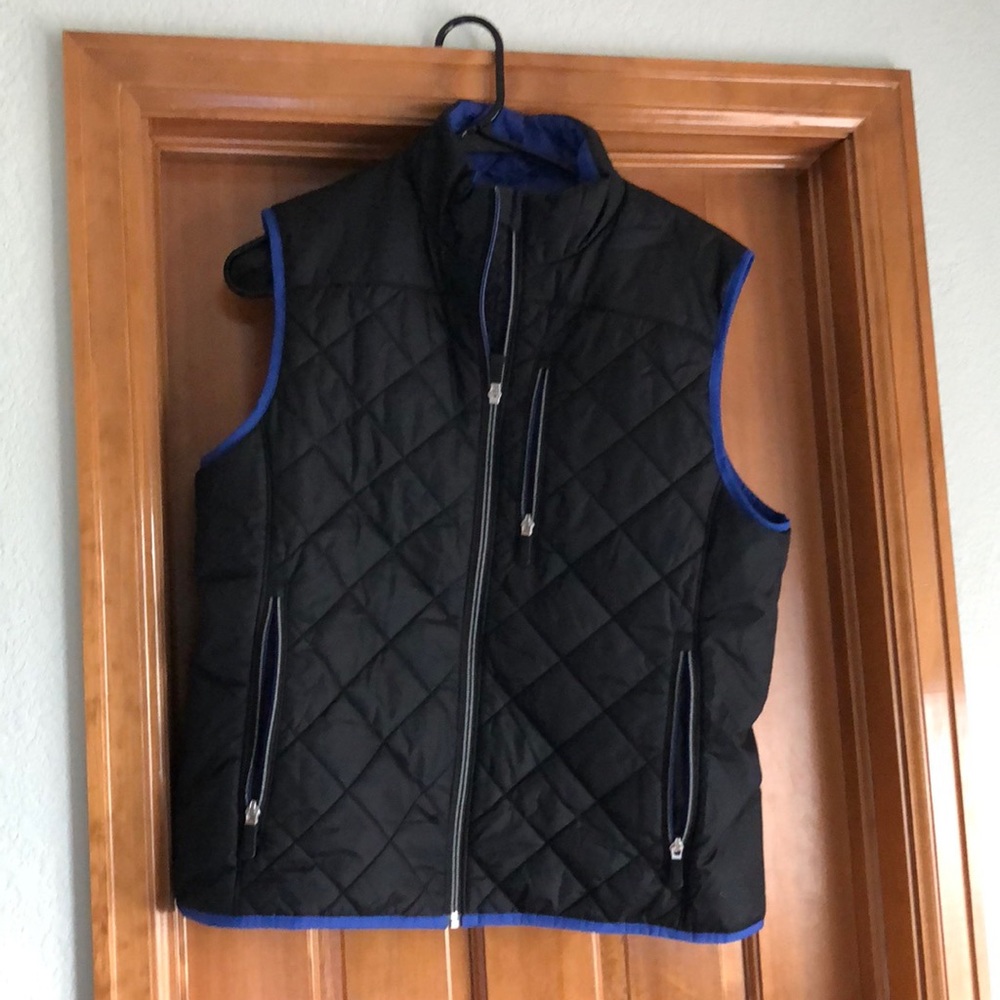Black vest with blue lining.